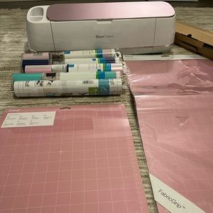 A large pink cricket with vinyls, etc